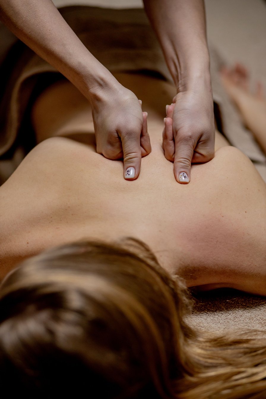 Body Care. Young Girl Having Massage, Relaxing in Spa Salon, Closeup